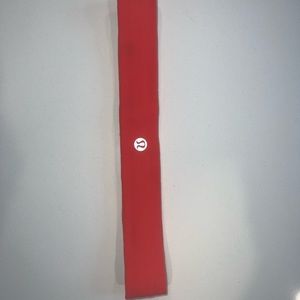 Women’s Lululemon orange red headband in very good condition barely worn